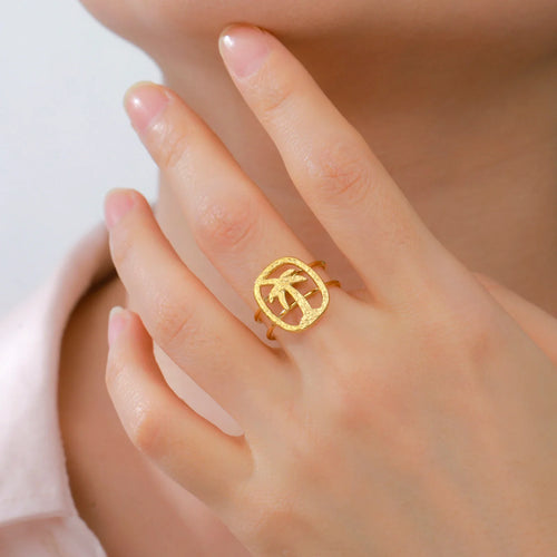Gold palm motif ring