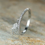 Ring with silver angel wings pendant