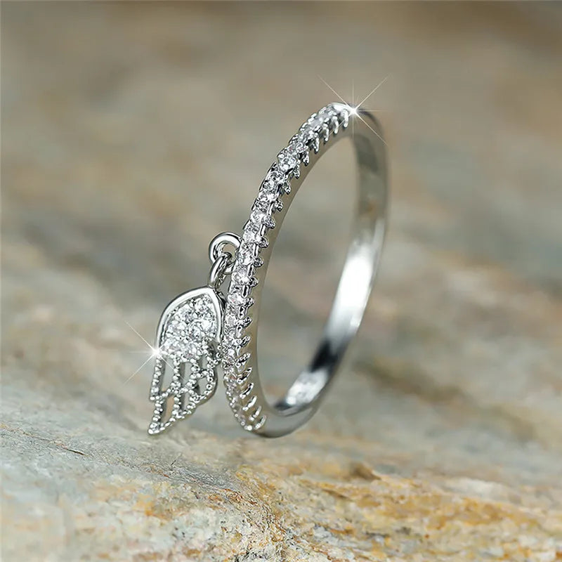 Ring with silver angel wings pendant