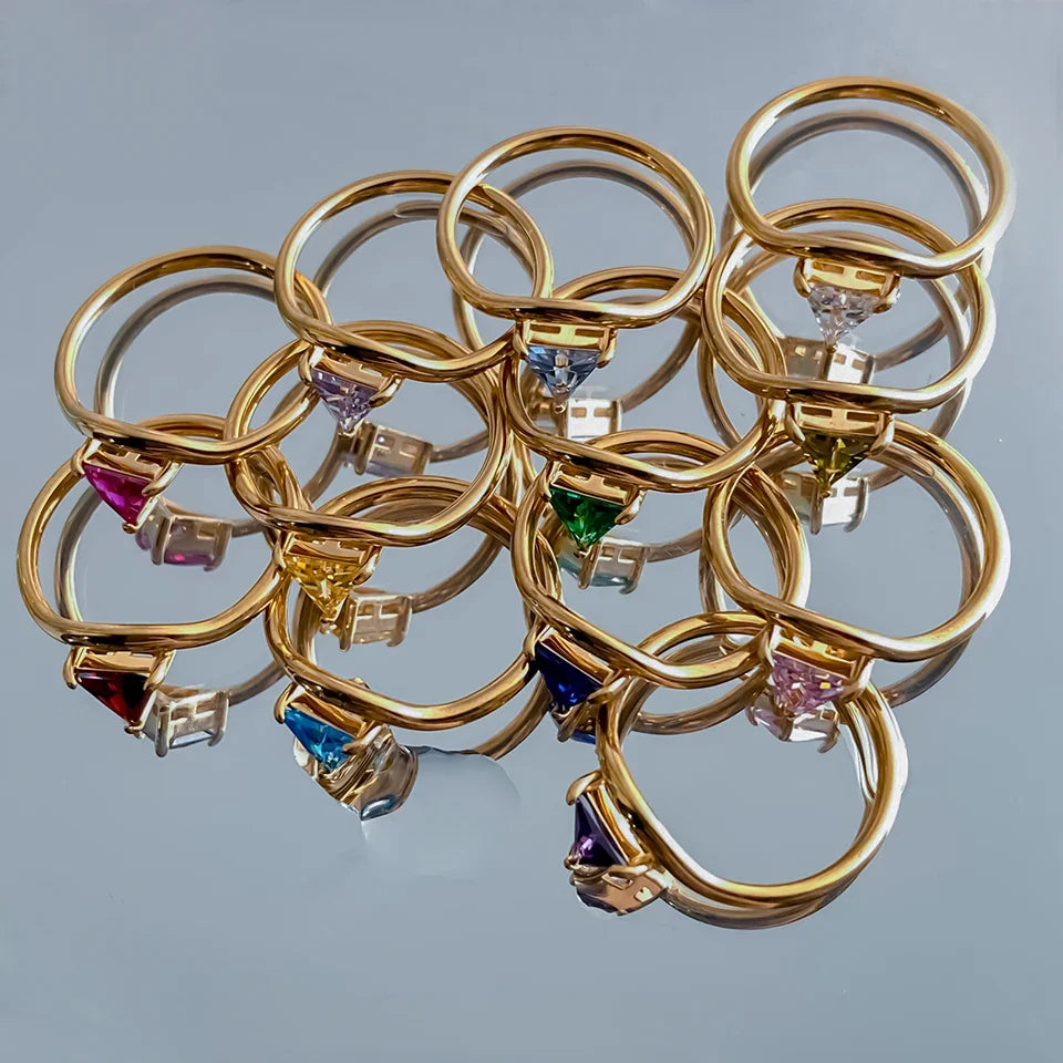 Gold ring with triangular birthstone 