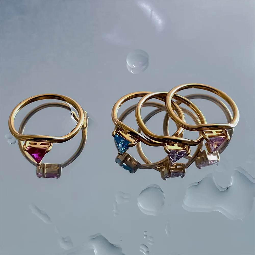 Gold ring with triangular birthstone