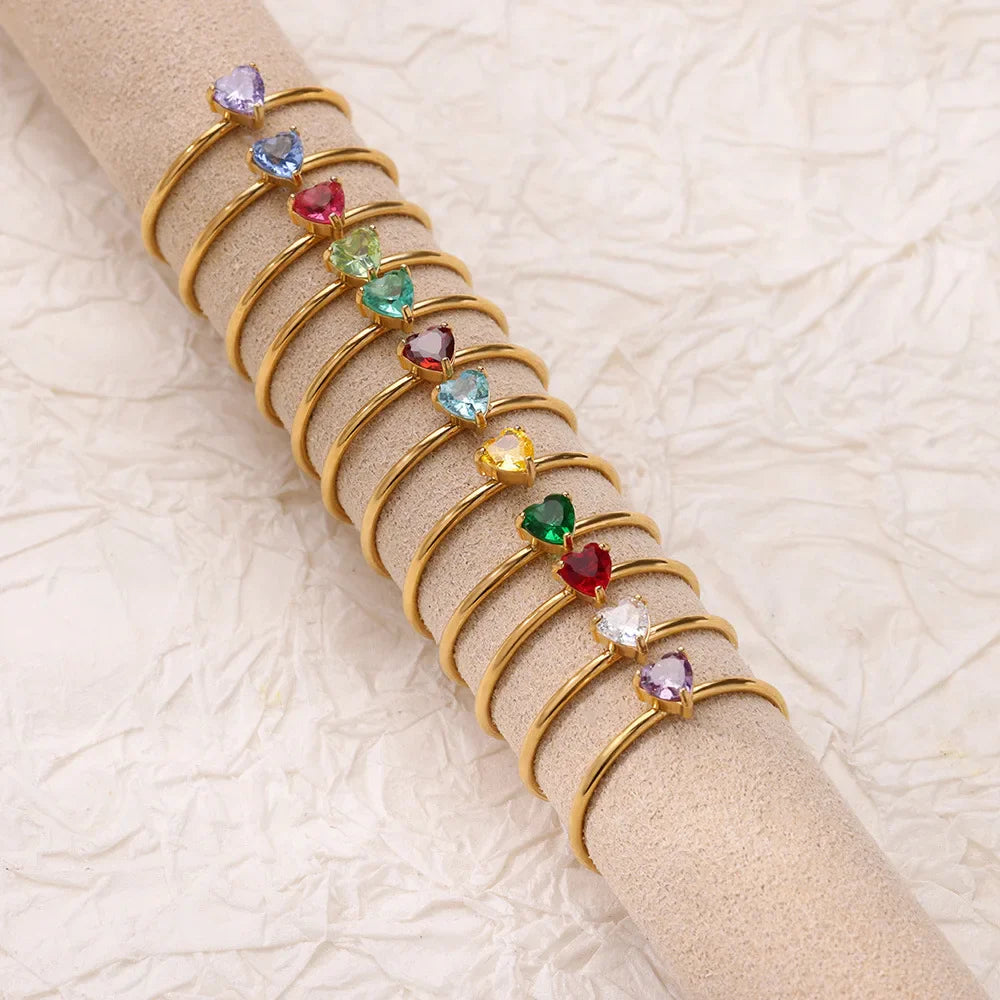 Delicate gold-plated ring with heart-shaped birthstone
