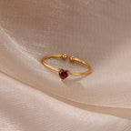 Delicate gold-plated ring with heart-shaped birthstone