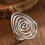 Wide textured spiral ring in silver