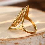 Wide textured spiral ring in gold