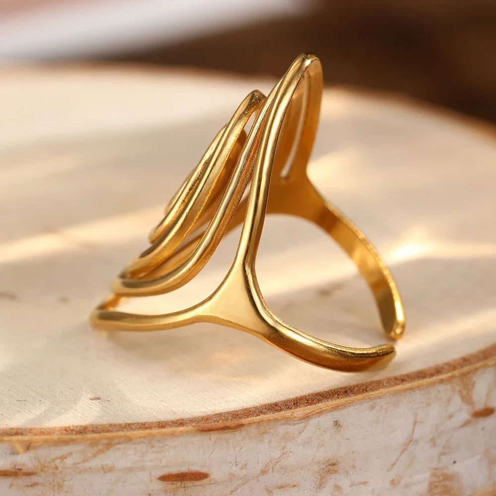 Wide textured spiral ring in gold