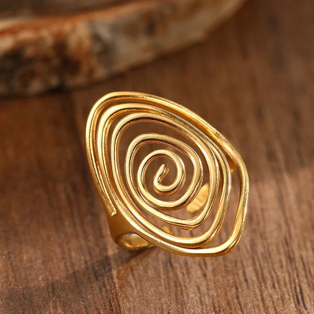 Wide textured spiral ring in gold