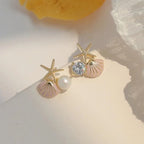 Asymmetrical pink seashell earrings