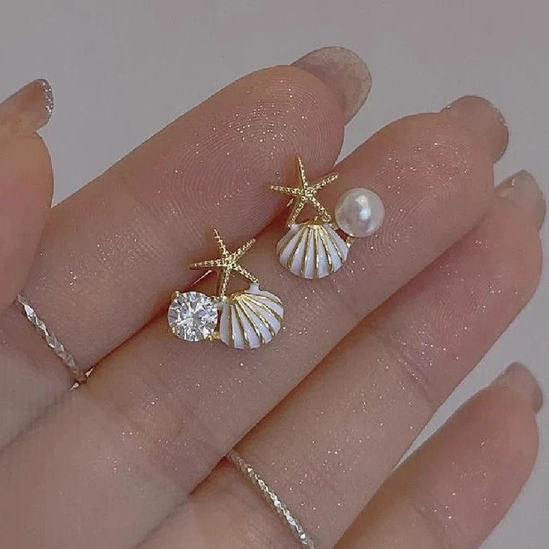 Asymmetrical white seashell earrings