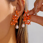 Orange coral and pearl earrings