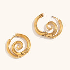 Gold hoop earrings with spiral motif