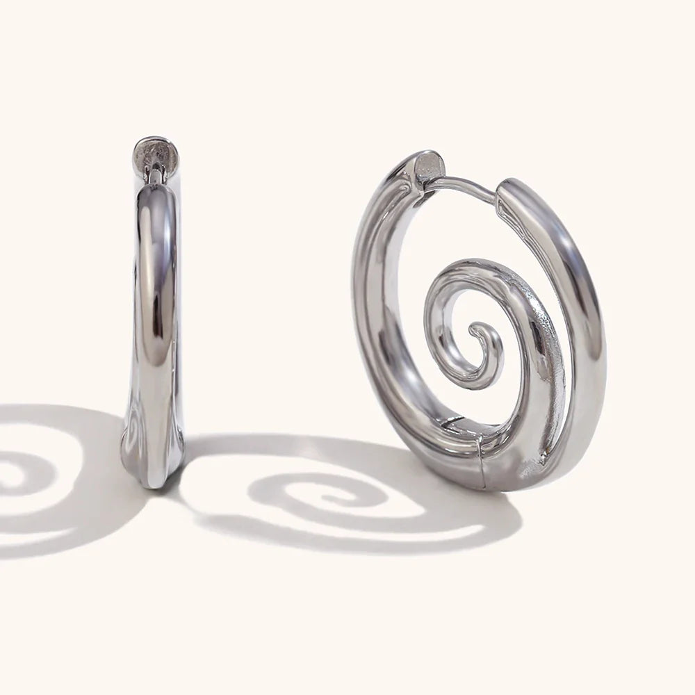Silver hoop earrings with spiral motif