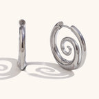 Silver hoop earrings with spiral motif