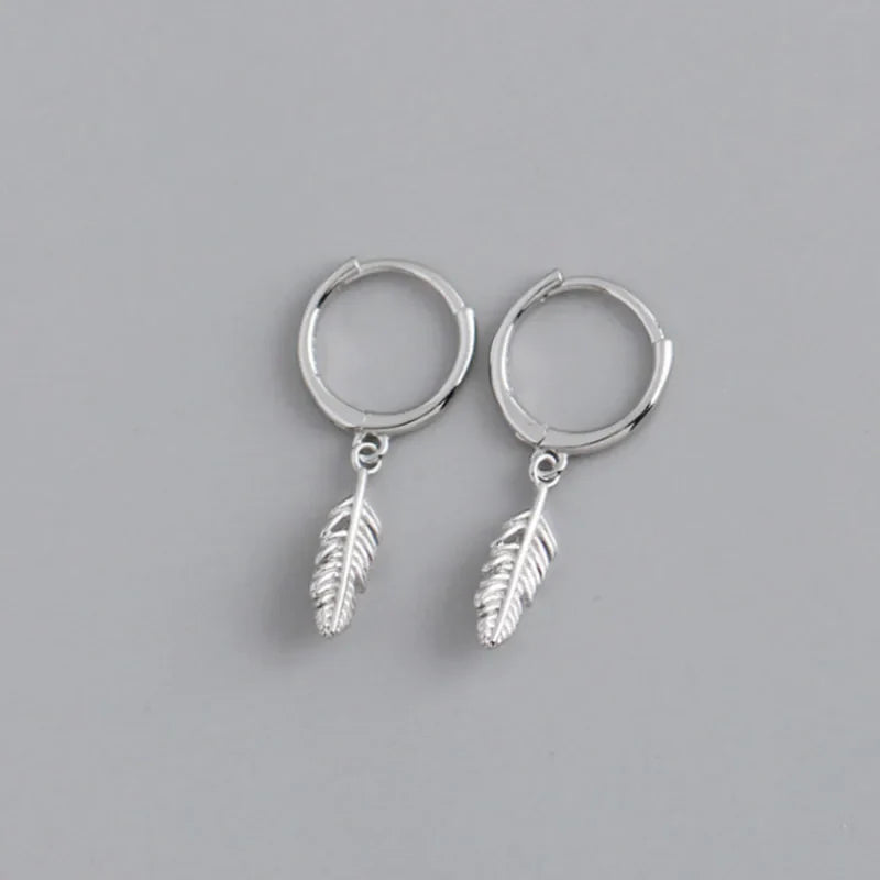 Hoop earrings with small dangling feather, silver