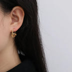 Star and Moon Dangle Hoop Earrings in gold
