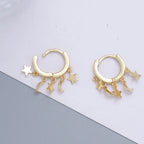 Star and Moon Dangle Hoop Earrings in gold