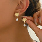 Gold shell and pearl earrings