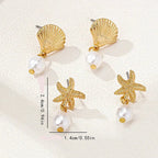 Gold shell and pearl earrings