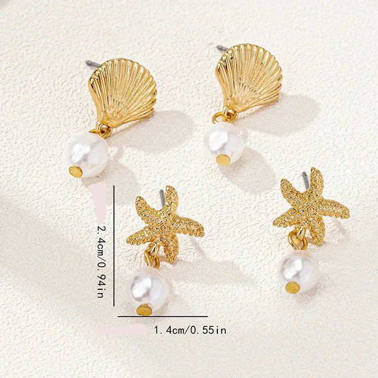 Gold shell and pearl earrings