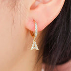 Women's hoop earrings with initial