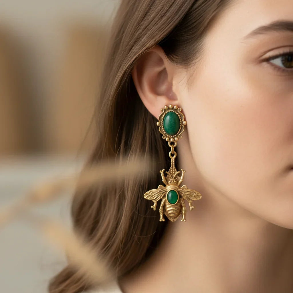 Green bee dangling earrings
