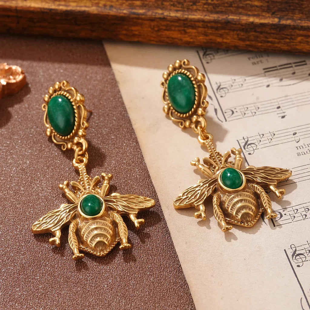 Green bee dangling earrings