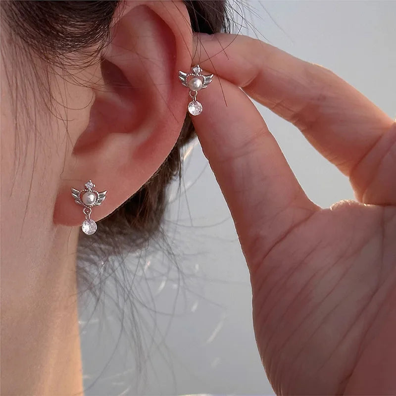 Dangling angel wing earrings
