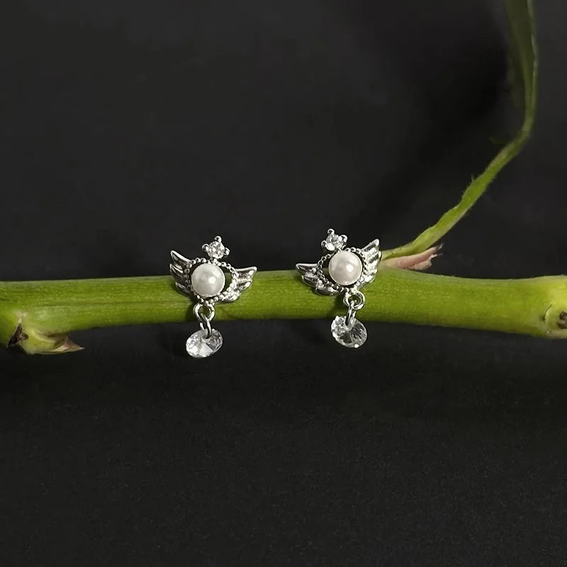Dangling angel wing earrings