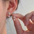 Dangling angel wing earrings