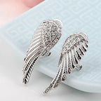 Angel wing dangling earrings with rhinestones silver