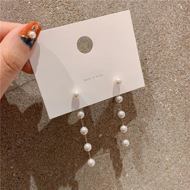 Dangling Earrings with White Pearls