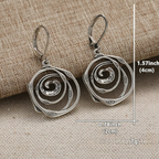 Dangling earrings with chiseled spiral
