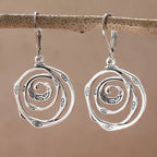 Dangling earrings with chiseled spiral