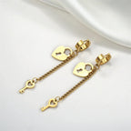 Gold key and lock dangle earrings