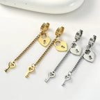 Gold key and lock dangle earrings