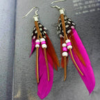 Apache-style feather earrings fuchsia