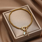 Bracelet with cross and birthstone