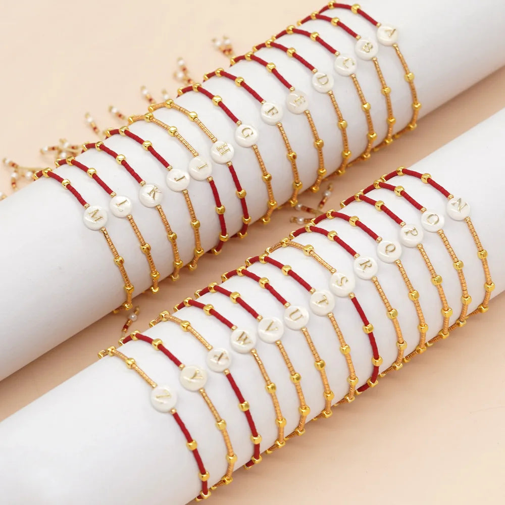 Bicolor initial bracelet