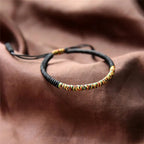 Tibetan Good Luck Bracelet in Black Cotton