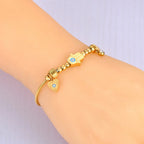 Protection Bracelet with Hamsa Hand and Blue Eye Gold