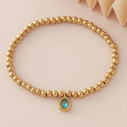 Gold bracelet with birthstone for women