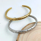 Elegant Bracelet with Gold Stars and Celestial Motifs