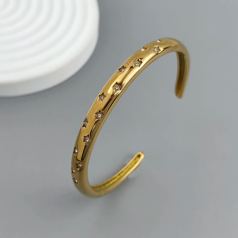 Elegant Bracelet with Gold Stars and Celestial Motifs