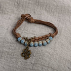 Rope Bracelet with Four-Leaf Clover and Blue Beads