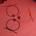 Cord Bracelet with Four-Leaf Clover in Dark Red Cinnabar Stone