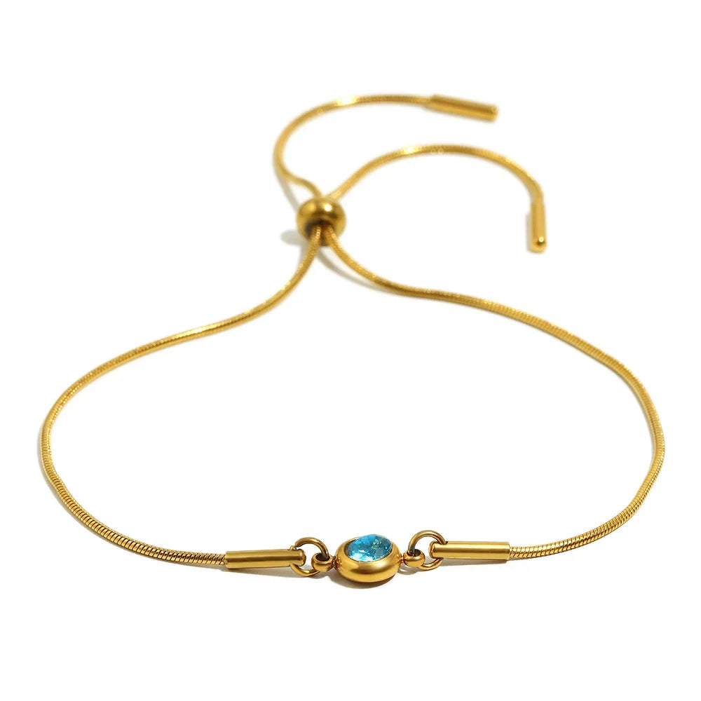 Bangle bracelet with colored birthstone