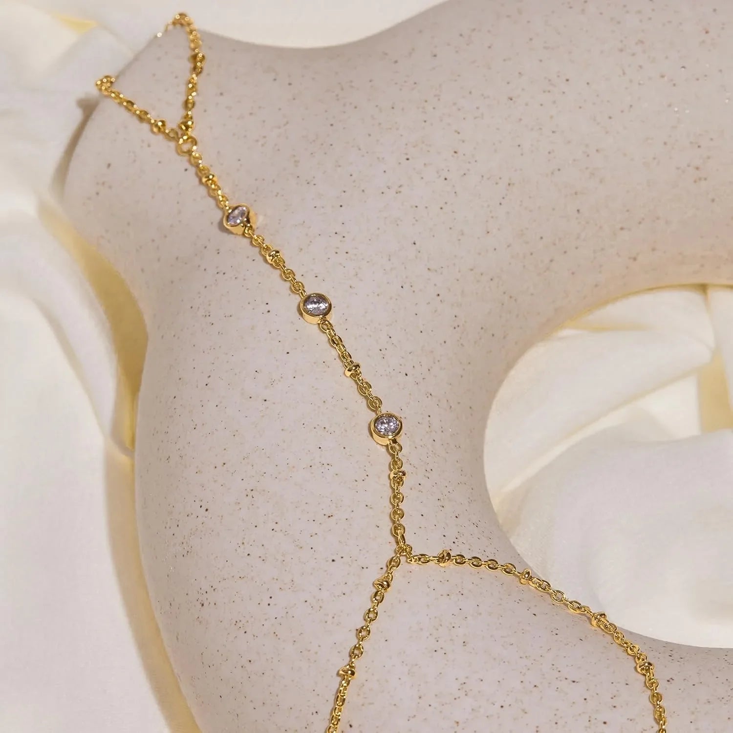 Hand and finger chain with zircons - women's hand bracelet gold
