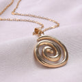 Necklace with large openwork spiral pendant in gold