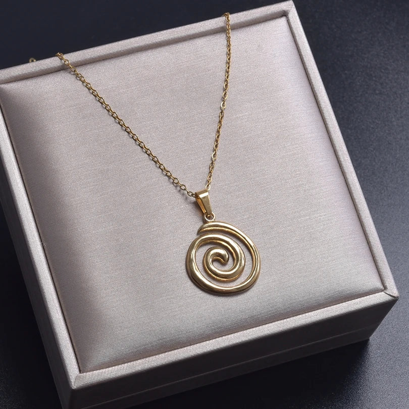 Necklace with large openwork spiral pendant in gold