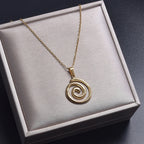 Necklace with large openwork spiral pendant in gold